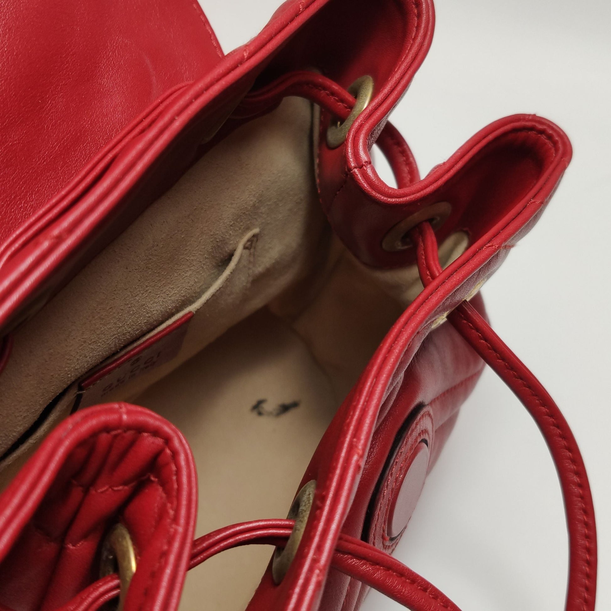 Gucci GG Marmont Leather Solid V-stitched GG Logo Drawstring Backpack 250503781176129