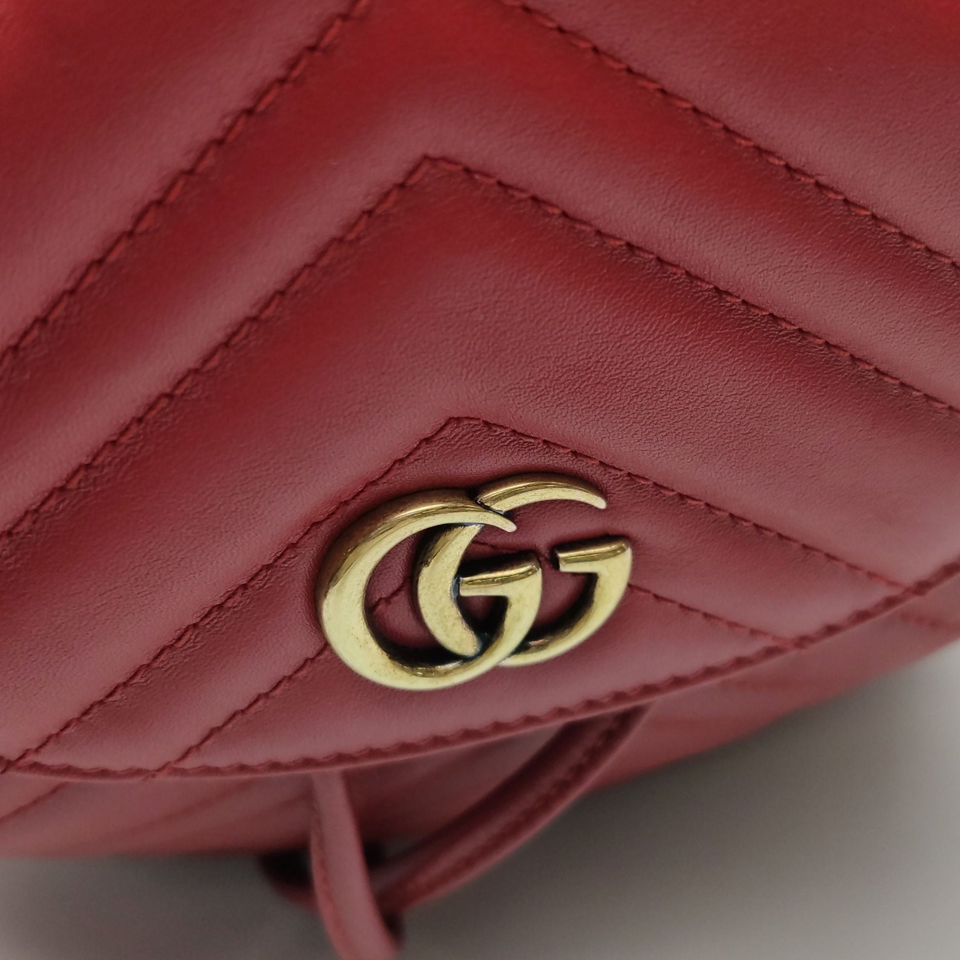 Gucci GG Marmont Leather Solid V-stitched GG Logo Drawstring Backpack 250503781176129